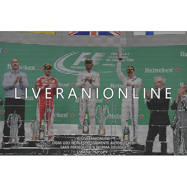 The podium (L to R): Sebastian Vettel (GER) Ferrari, second; Lewis Hamilton (GBR) Mercedes AMG F1, race winner; Valtteri Bottas (FIN) Williams, third. 12.06.2016. Formula 1 World Championship, Rd 7, Canadian Grand Prix, Montreal, Canada, Race Day. AG ALDO LIVERANI SAS ONLY ITALY