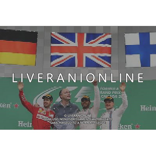 The podium (L to R): Sebastian Vettel (GER) Ferrari, second; Lewis Hamilton (GBR) Mercedes AMG F1, race winner; Valtteri Bottas (FIN) Williams, third. 12.06.2016. Formula 1 World Championship, Rd 7, Canadian Grand Prix, Montreal, Canada, Race Day. AG ALDO LIVERANI SAS ONLY ITALY