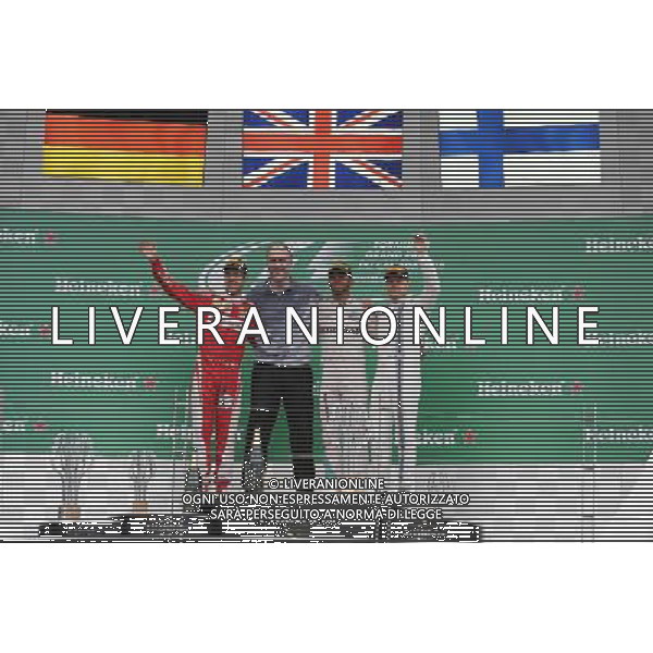 The podium (L to R): Sebastian Vettel (GER) Ferrari, second; Lewis Hamilton (GBR) Mercedes AMG F1, race winner; Valtteri Bottas (FIN) Williams, third. 12.06.2016. Formula 1 World Championship, Rd 7, Canadian Grand Prix, Montreal, Canada, Race Day. AG ALDO LIVERANI SAS ONLY ITALY