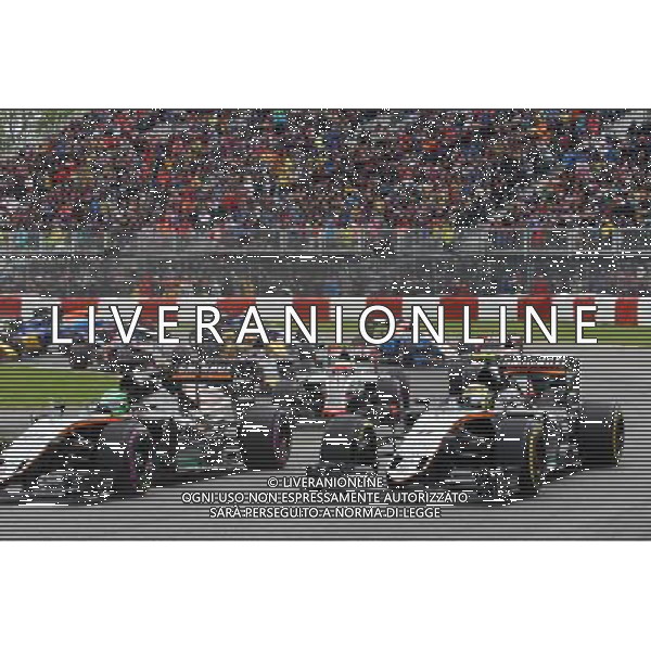 Nico Hulkenberg (GER) Sahara Force India F1 VJM09 and Sergio Perez (MEX) Sahara Force India F1 VJM09 at the start of the race. 12.06.2016. Formula 1 World Championship, Rd 7, Canadian Grand Prix, Montreal, Canada, Race Day. AG ALDO LIVERANI SAS ONLY ITALY