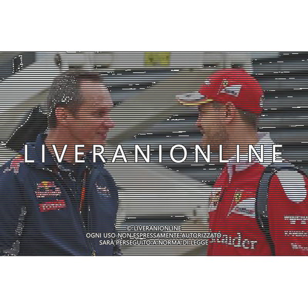 (L to R): Paul Monaghan (GBR) Red Bull Racing Chief Engineer with Sebastian Vettel (GER) Ferrari. 07.07.2016. Formula 1 World Championship, Rd 10, British Grand Prix, Silverstone, England, Preparation Day. AG ALDO LIVERANI SAS ONLY ITALY