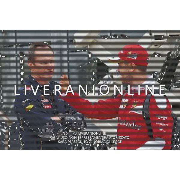 (L to R): Paul Monaghan (GBR) Red Bull Racing Chief Engineer with Sebastian Vettel (GER) Ferrari. 07.07.2016. Formula 1 World Championship, Rd 10, British Grand Prix, Silverstone, England, Preparation Day. AG ALDO LIVERANI SAS ONLY ITALY
