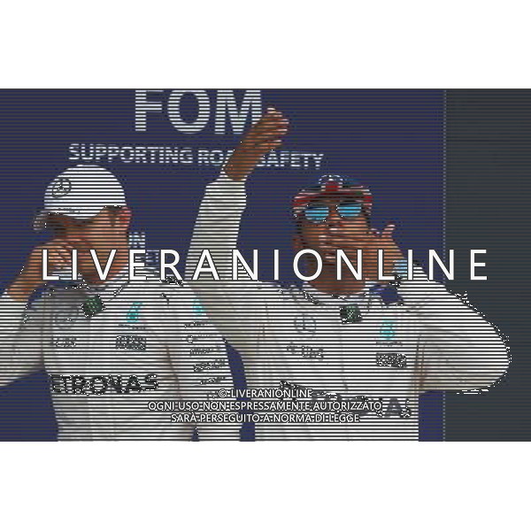 Lewis Hamilton (GBR) Mercedes AMG F1 celebrates his pole position in parc ferme with Nico Rosberg (GER) Mercedes AMG F1 (Left). 09.07.2016. Formula 1 World Championship, Rd 10, British Grand Prix, Silverstone, England, Qualifying Day. AG ALDO LIVERANI SAS ONLY ITALY