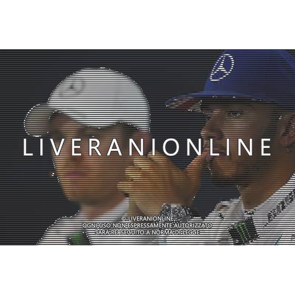 Lewis Hamilton (GBR) Mercedes AMG F1 and team mate Nico Rosberg (GER) Mercedes AMG F1 in the FIA Press Conference. 09.07.2016. Formula 1 World Championship, Rd 10, British Grand Prix, Silverstone, England, Qualifying Day. AG ALDO LIVERANI SAS ONLY ITALY