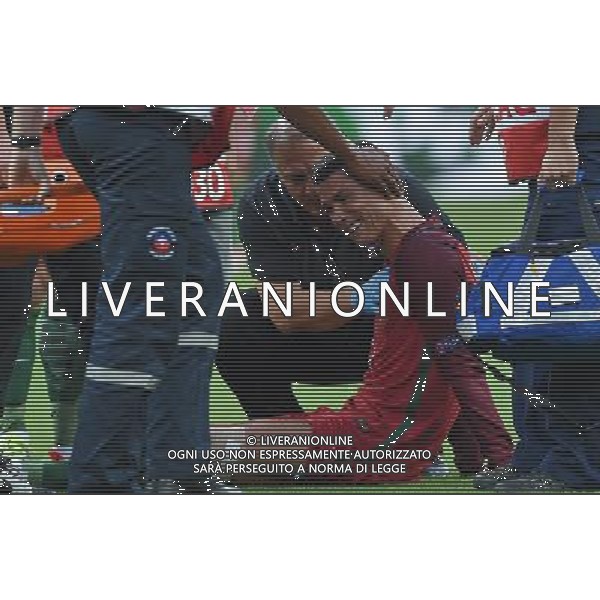 UEFA Francia EURO 2016 Final Tournament Final Parigi Saint-Denis - 10.07.2016 Portogallo-Francia Nella Foto: cristiano ronaldo a terra sofferente e dolorante dopo l\'infortunio, e esce dal campo in lacrime /Ph.Vitez-Ag. Aldo Liverani