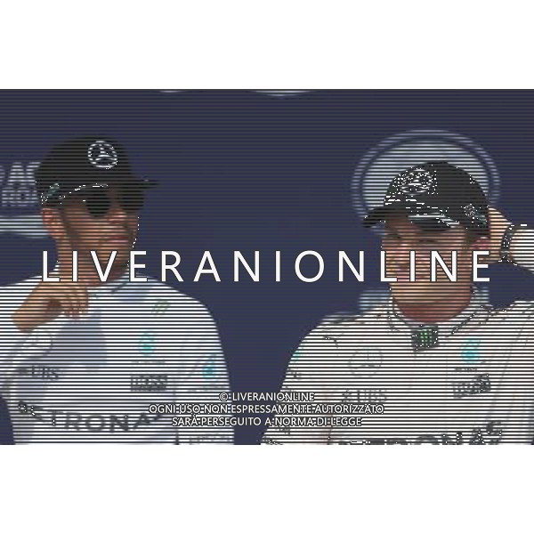 Nico Rosberg (GER), Mercedes AMG F1 Team and Lewis Hamilton (GBR), Mercedes AMG F1 Team 23.07.2016. Formula 1 World Championship, Rd 11, Hungarian Grand Prix, Budapest, Hungary, Qualifying Day. AG ALDO LIVERANI SAS ONLY ITALY