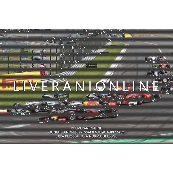 (L to R): Lewis Hamilton (GBR) Mercedes AMG F1; Nico Rosberg (GER) Mercedes AMG F1; and Daniel Ricciardo (AUS) Red Bull Racing battle for the lead at the start of the race. 24.07.2016. Formula 1 World Championship, Rd 11, Hungarian Grand Prix, Budapest, Hungary, Race Day. /AGENZIA ALDO LIVERANI Sas - ITALY ONLY EDITORIAL USE ONLY - GP F1 Ungheria Gara