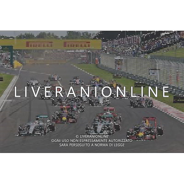 (L to R): Lewis Hamilton (GBR) Mercedes AMG F1; Nico Rosberg (GER) Mercedes AMG F1; and Daniel Ricciardo (AUS) Red Bull Racing battle for the lead at the start of the race. 24.07.2016. Formula 1 World Championship, Rd 11, Hungarian Grand Prix, Budapest, Hungary, Race Day. /AGENZIA ALDO LIVERANI Sas - ITALY ONLY EDITORIAL USE ONLY - GP F1 Ungheria Gara