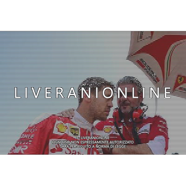 Sebastian Vettel (GER) Ferrari with Maurizio Arrivabene (ITA) Ferrari Team Principal on the grid. 24.07.2016. Formula 1 World Championship, Rd 11, Hungarian Grand Prix, Budapest, Hungary, Race Day. ag aldo liverani sas onlyitaly