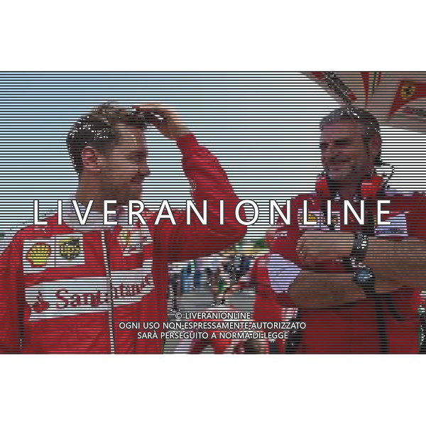 Sebastian Vettel (GER) Ferrari with Maurizio Arrivabene (ITA) Ferrari Team Principal on the grid. 24.07.2016. Formula 1 World Championship, Rd 11, Hungarian Grand Prix, Budapest, Hungary, Race Day. ag aldo liverani sas onlyitaly