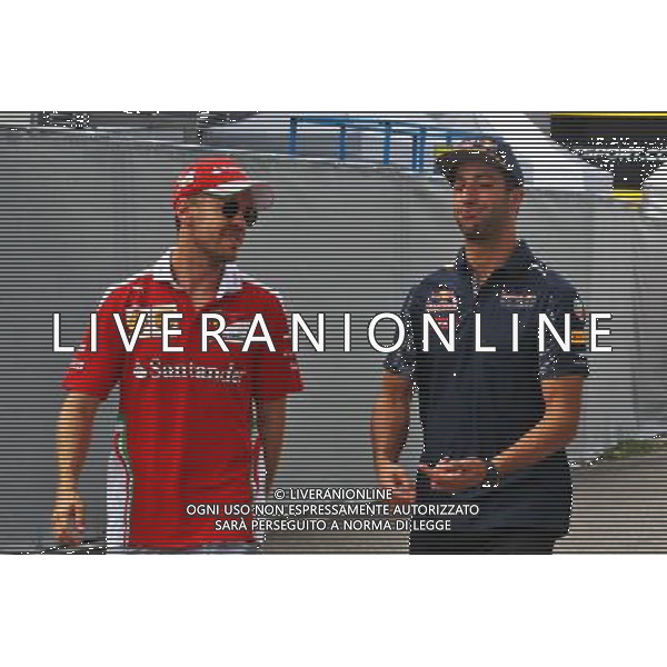 (L to R): Sebastian Vettel (GER) Ferrari with Daniel Ricciardo (AUS) Red Bull Racing. 28.07.2016. Formula 1 World Championship, Rd 12, German Grand Prix, Hockenheim, Germany, Preparation Day. AG ALDO LIVERANI SAS ONLY ITALY AG ALDO LIVERANI SAS ONLY ITALY