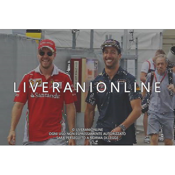 (L to R): Sebastian Vettel (GER) Ferrari with Daniel Ricciardo (AUS) Red Bull Racing. 28.07.2016. Formula 1 World Championship, Rd 12, German Grand Prix, Hockenheim, Germany, Preparation Day. AG ALDO LIVERANI SAS ONLY ITALY AG ALDO LIVERANI SAS ONLY ITALY