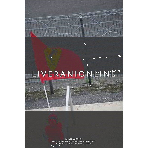 A youn Ferrari fan with a flag. 29.07.2016. Formula 1 World Championship, Rd 12, German Grand Prix, Hockenheim, Germany, Practice Day. AG ALDO LIVERANI SAS ONLY ITALY