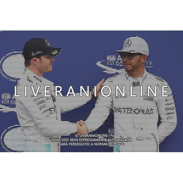 Nico Rosberg (GER) Mercedes AMG Petronas F1 W07 gets pole position and shakes hand with Lewis Hamilton (GBR) Mercedes AMG F1 W07 . 30.07.2016. Formula 1 World Championship, Rd 12, German Grand Prix, Hockenheim, Germany, Qualifying Day. AG ALDO LIVERANI SAS ONLY ITALY