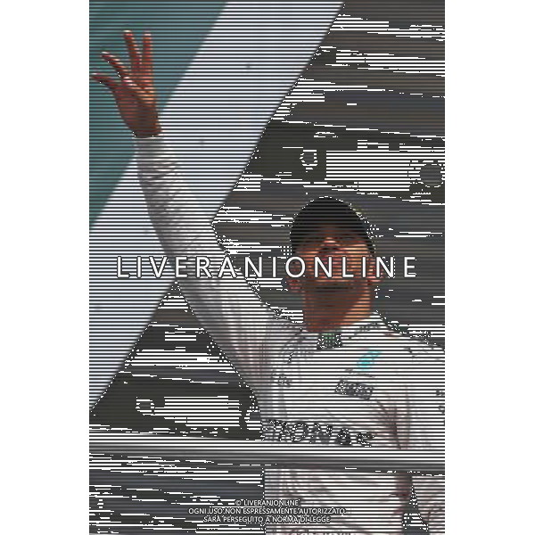 Race winner Lewis Hamilton (GBR) Mercedes AMG F1 celebrates on the podium. 31.07.2016. Formula 1 World Championship, Rd 12, German Grand Prix, Hockenheim, Germany, Race Day. AG ALDO LIVERANI SAS ONLY ITALY
