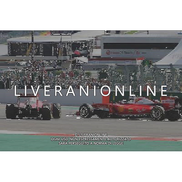 Sebastian Vettel (GER) Ferrari SF16-H spins alongside team mate Kimi Raikkonen (FIN) Ferrari SF16-H at the start of the race. 28.08.2016. Formula 1 World Championship, Rd 13, Belgian Grand Prix, Spa Francorchamps, Belgium, Race Day. / AGENZIA ALDO LIVERANI SAS - ITALY ONLY EDITORIAL USE ONLY