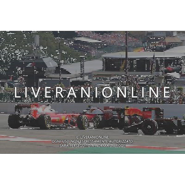 Sebastian Vettel (GER) Ferrari SF16-H spins alongside team mate Kimi Raikkonen (FIN) Ferrari SF16-H at the start of the race. 28.08.2016. Formula 1 World Championship, Rd 13, Belgian Grand Prix, Spa Francorchamps, Belgium, Race Day. / AGENZIA ALDO LIVERANI SAS - ITALY ONLY EDITORIAL USE ONLY