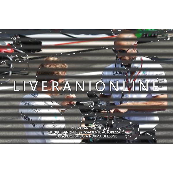 Nico Rosberg (GER) Mercedes AMG F1 with Daniel Schloesser (GER) Mercedes AMG F1 Physio in the pits as the race is stopped. 28.08.2016. Formula 1 World Championship, Rd 13, Belgian Grand Prix, Spa Francorchamps, Belgium, Race Day. / AGENZIA ALDO LIVERANI SAS - ITALY ONLY EDITORIAL USE ONLY