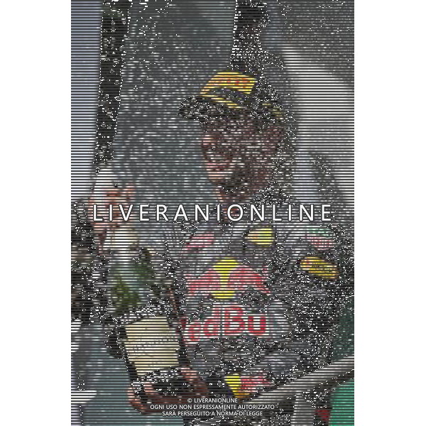 Daniel Ricciardo (AUS) Red Bull Racing celebrates his second position with the champagne on the podium. 28.08.2016. Formula 1 World Championship, Rd 13, Belgian Grand Prix, Spa Francorchamps, Belgium, Race Day. / AGENZIA ALDO LIVERANI SAS - ITALY ONLY EDITORIAL USE ONLY