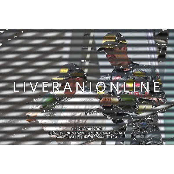 (L to R): third placed Lewis Hamilton (GBR) Mercedes AMG F1 and second placed Daniel Ricciardo (AUS) Red Bull Racing celebrate with the champagne on the podium. 28.08.2016. Formula 1 World Championship, Rd 13, Belgian Grand Prix, Spa Francorchamps, Belgium, Race Day. / AGENZIA ALDO LIVERANI SAS - ITALY ONLY EDITORIAL USE ONLY