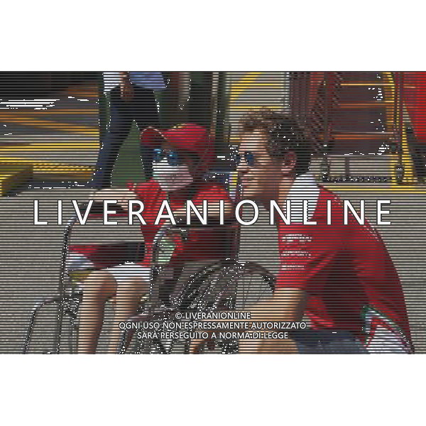 Sebastian Vettel (GER) Ferrari with a young fan. 01.09.2016. Formula 1 World Championship, Rd 14, Italian Grand Prix, Monza, Italy, Preparation Day. / AGENZIA ALDO LIVERANI SAS - ITALY ONLY EDITORIAL USE ONLY