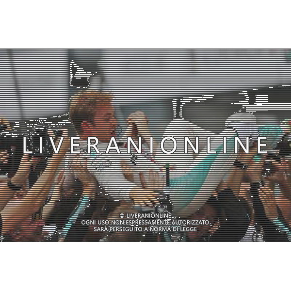 Race winner Nico Rosberg (GER) Mercedes AMG F1 celebrates with the team in parc ferme. 04.09.2016. Formula 1 World Championship, Rd 14, Italian Grand Prix, Monza, Italy, Race Day. AG ALDO LIVERANI SAS ONLY ITALY