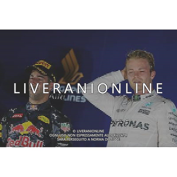 The podium (L to R): second placed Daniel Ricciardo (AUS) Red Bull Racing and race winner Nico Rosberg (GER) Mercedes AMG F1. 18.09.2016. Formula 1 World Championship, Rd 15, Singapore Grand Prix, Marina Bay Street Circuit, Singapore, Race Day. / AGENZIA ALDO LIVERANI SAS - ITALY ONLY EDITORIAL USE ONLY