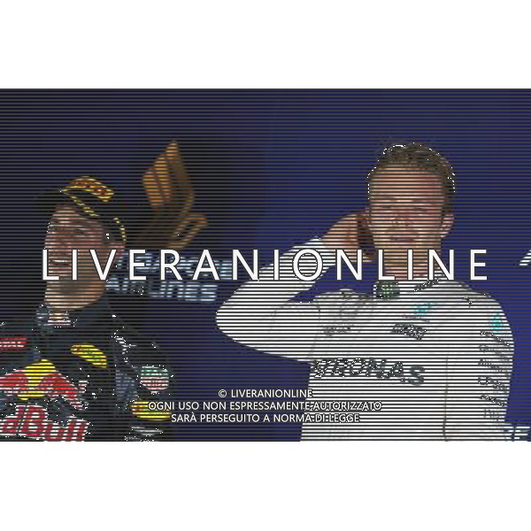 The podium (L to R): second placed Daniel Ricciardo (AUS) Red Bull Racing and race winner Nico Rosberg (GER) Mercedes AMG F1. 18.09.2016. Formula 1 World Championship, Rd 15, Singapore Grand Prix, Marina Bay Street Circuit, Singapore, Race Day. / AGENZIA ALDO LIVERANI SAS - ITALY ONLY EDITORIAL USE ONLY