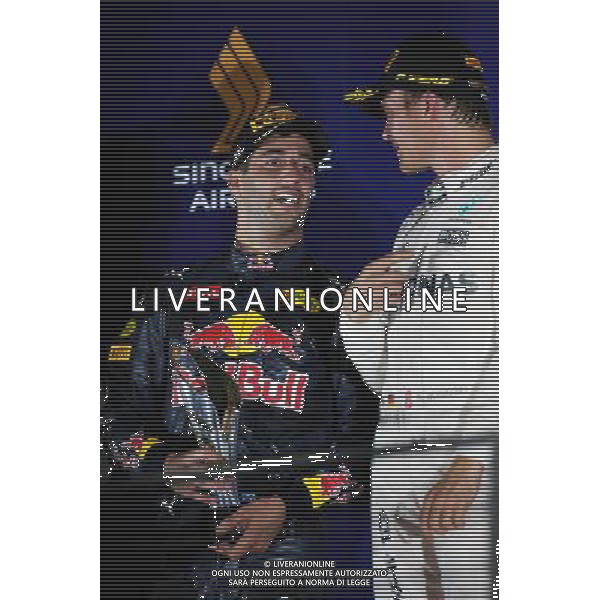 (L to R): second placed Daniel Ricciardo (AUS) Red Bull Racing and race winner Nico Rosberg (GER) Mercedes AMG F1 on the podium. 18.09.2016. Formula 1 World Championship, Rd 15, Singapore Grand Prix, Marina Bay Street Circuit, Singapore, Race Day. / AGENZIA ALDO LIVERANI SAS - ITALY ONLY EDITORIAL USE ONLY