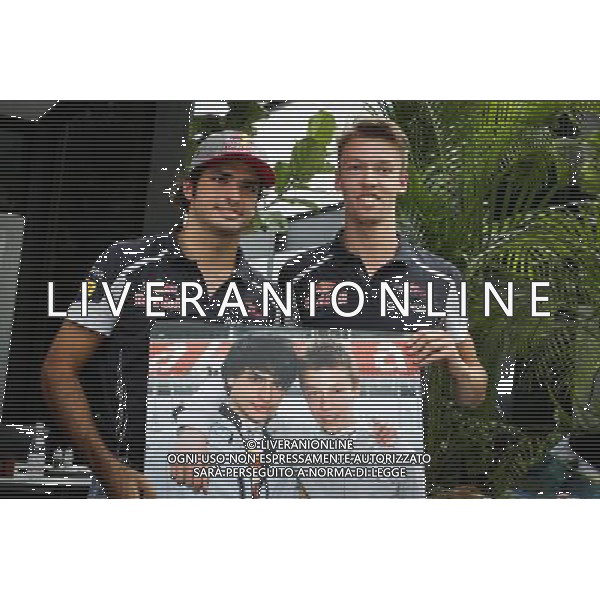 (L to R): Carlos Sainz Jr (ESP) Scuderia Toro Rosso with Daniil Kvyat (RUS) Scuderia Toro Rosso. 29.09.2016. Formula 1 World Championship, Rd 16, Malaysian Grand Prix, Sepang, Malaysia, Thursday. / AGENZIA ALDO LIVERANI SAS - ITALY ONLY EDITORIAL USE ONLY