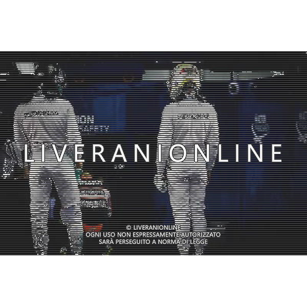 (L to R): Nico Rosberg (GER) Mercedes AMG F1 and team mate Lewis Hamilton (GBR) Mercedes AMG F1 in parc ferme. 08.10.2016. Formula 1 World Championship, Rd 17, Japanese Grand Prix, Suzuka, Japan, Qualifying Day. AG ALDO LIVERANI SAS ONLY ITALY
