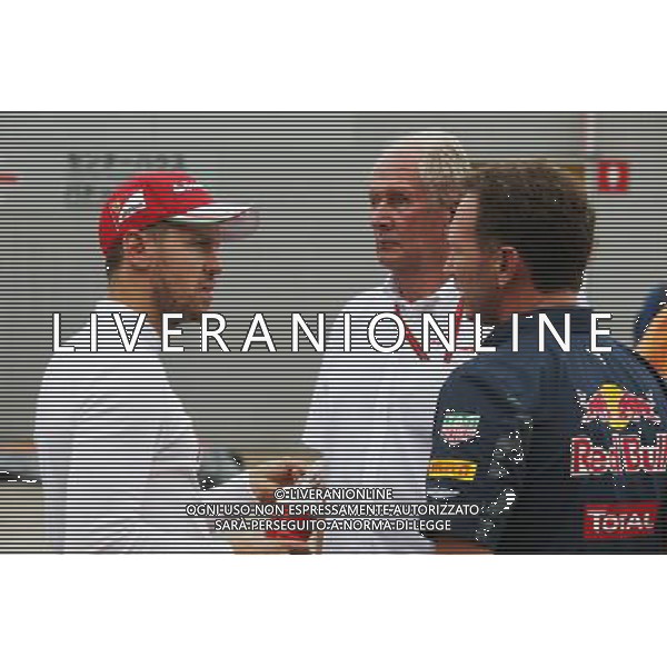 (L to R): Sebastian Vettel (GER) Ferrari with Dr Helmut Marko (AUT) Red Bull Motorsport Consultant and Christian Horner (GBR) Red Bull Racing Team Principal. 08.10.2016. Formula 1 World Championship, Rd 17, Japanese Grand Prix, Suzuka, Japan, Qualifying D AG ALDO LIVERANI SAS ONLY ITALY