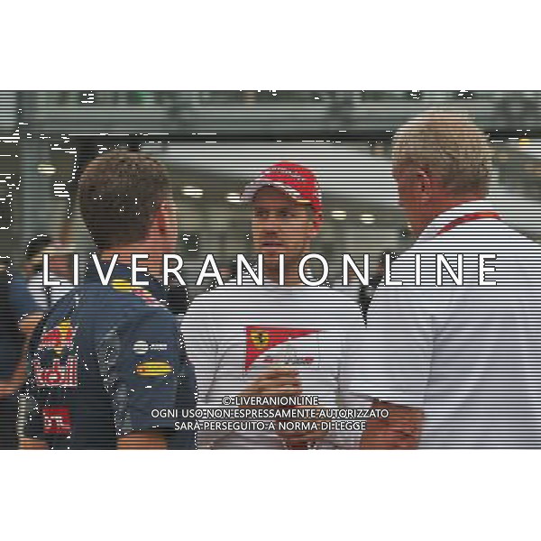 (L to R): Christian Horner (GBR) Red Bull Racing Team Principal with Sebastian Vettel (GER) Ferrari and Dr Helmut Marko (AUT) Red Bull Motorsport Consultant. 08.10.2016. Formula 1 World Championship, Rd 17, Japanese Grand Prix, Suzuka, Japan, Qualifying Day. AG ALDO LIVERANI SAS ONLY ITALY