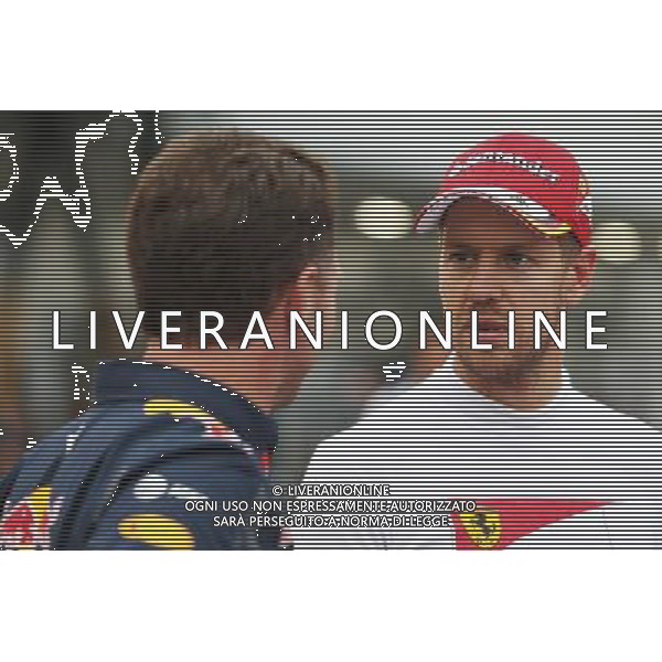 (L to R): Christian Horner (GBR) Red Bull Racing Team Principal with Sebastian Vettel (GER) Ferrari. 08.10.2016. Formula 1 World Championship, Rd 17, Japanese Grand Prix, Suzuka, Japan, Qualifying Day. AG ALDO LIVERANI SAS ONLY ITALY