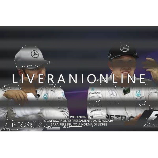(L to R): Lewis Hamilton (GBR) Mercedes AMG F1 and team mate Nico Rosberg (GER) Mercedes AMG F1 in the post qualifying FIA Press Conference. 08.10.2016. Formula 1 World Championship, Rd 17, Japanese Grand Prix, Suzuka, Japan, Qualifying Day. AG ALDO LIVERANI SAS ONLY ITALY
