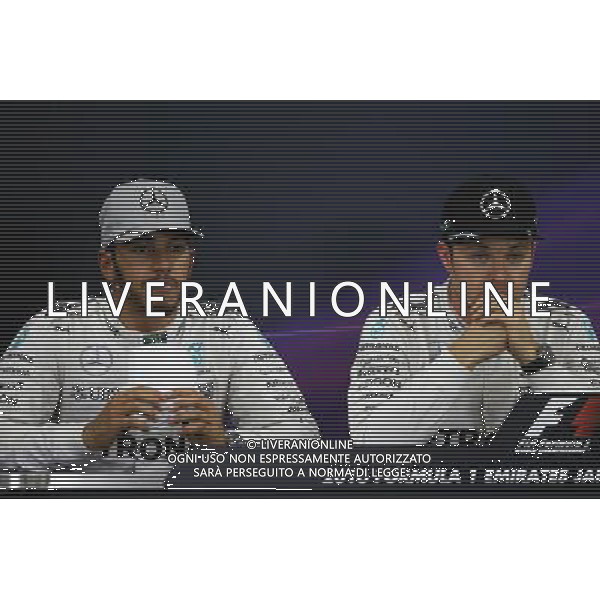 (L to R): Lewis Hamilton (GBR) Mercedes AMG F1 and team mate Nico Rosberg (GER) Mercedes AMG F1 in the post qualifying FIA Press Conference. 08.10.2016. Formula 1 World Championship, Rd 17, Japanese Grand Prix, Suzuka, Japan, Qualifying Day. AG ALDO LIVERANI SAS ONLY ITALY