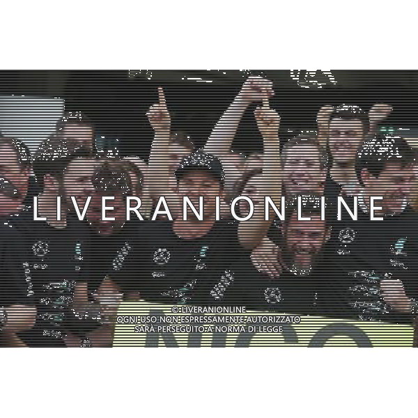 Race winner Nico Rosberg (GER) Mercedes AMG F1 celebrates the Constructors\' title with Toto Wolff (GER) Mercedes AMG F1 Shareholder and Executive Director, and the team. 09.10.2016. Formula 1 World Championship, Rd 17, Japanese Grand Prix, Suzuka, Japan, Race Day. AG ALDO LIVERANI SAS ONLY ITALY