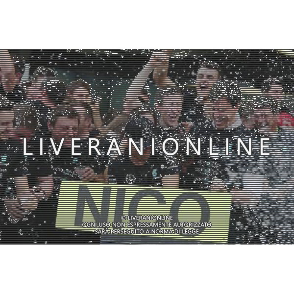 Race winner Nico Rosberg (GER) Mercedes AMG F1 celebrates the Constructors\' title with Toto Wolff (GER) Mercedes AMG F1 Shareholder and Executive Director, and the team. 09.10.2016. Formula 1 World Championship, Rd 17, Japanese Grand Prix, Suzuka, Japan, Race Day. AG ALDO LIVERANI SAS ONLY ITALY