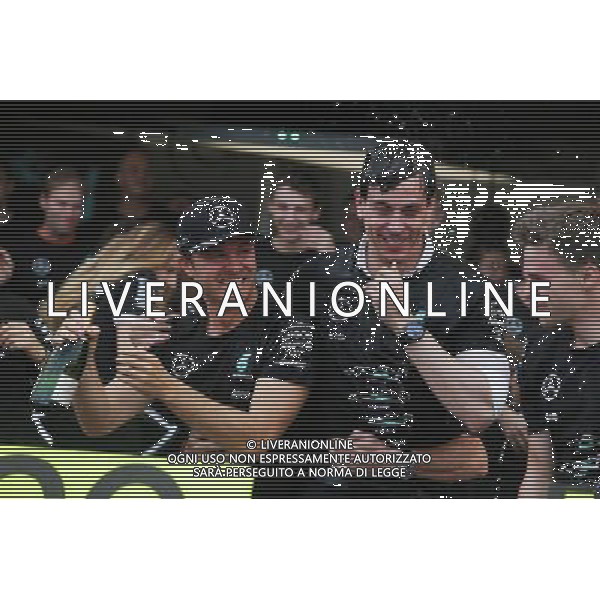 Race winner Nico Rosberg (GER) Mercedes AMG F1 celebrates the Constructors\' title with Toto Wolff (GER) Mercedes AMG F1 Shareholder and Executive Director, and the team. 09.10.2016. Formula 1 World Championship, Rd 17, Japanese Grand Prix, Suzuka, Japan, Race Day. AG ALDO LIVERANI SAS ONLY ITALY