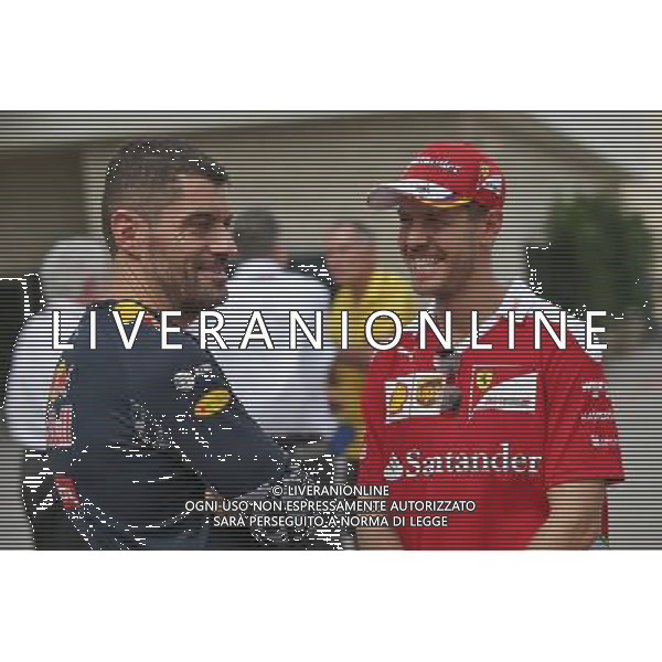 (L to R): Guillaume Rocquelin (ITA) Red Bull Racing Head of Race Engineering with Sebastian Vettel (GER) Ferrari. 20.10.2016. Formula 1 World Championship, Rd 18, United States Grand Prix, Austin, Texas, USA, Preparation Day. AG ALDO LIVERANI SAS ONLY ITALY