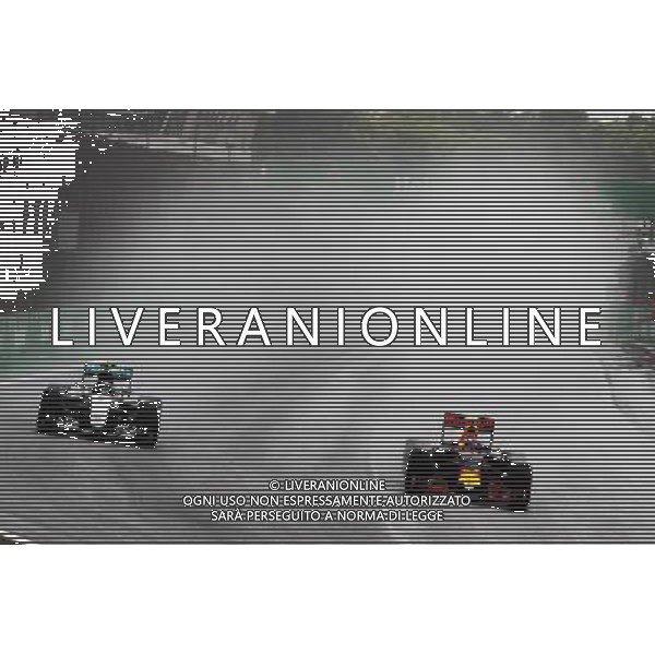 (L to R): Nico Rosberg (GER) Mercedes AMG F1 W07 Hybrid and Max Verstappen (NLD) Red Bull Racing RB12 battle for position. 13.11.2016. Formula 1 World Championship, Rd 20, Brazilian Grand Prix, Sao Paulo, Brazil, Race Day. AG ALDO LIVERANI SAS ONLY ITALY