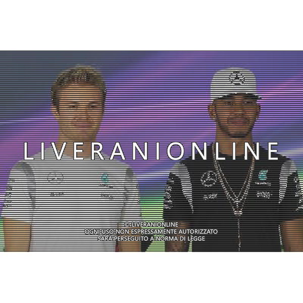 (L to R): Nico Rosberg (GER) Mercedes AMG F1 with team mate Lewis Hamilton (GBR) Mercedes AMG F1 in the FIA Press Conference. 24.11.2016. Formula 1 World Championship, Rd 21, Abu Dhabi Grand Prix, Yas Marina Circuit, Abu Dhabi, Preparation Day. AG ALDO LIVERANI SAS ONLY ITALY
