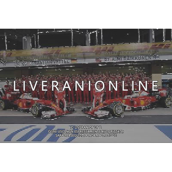 (L to R): Sebastian Vettel (GER) Ferrari and team mate Kimi Raikkonen (FIN) Ferrari at a team photograph. 24.11.2016. Formula 1 World Championship, Rd 21, Abu Dhabi Grand Prix, Yas Marina Circuit, Abu Dhabi, Preparation Day. AG ALDO LIVERANI SAS ONLY ITALY