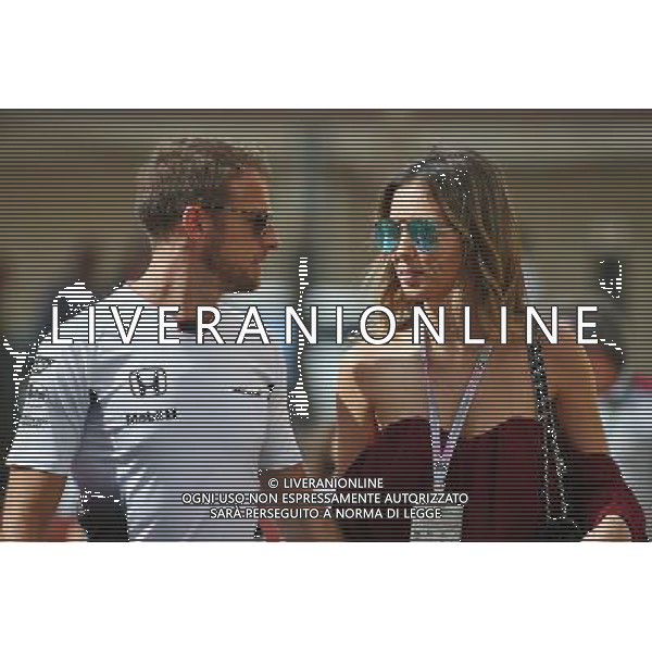 Jenson Button (GBR) McLaren with his girlfriend Brittny Ward (USA). 25.11.2016. Formula 1 World Championship, Rd 21, Abu Dhabi Grand Prix, Yas Marina Circuit, Abu Dhabi, Practice Day. AG ALDO LIVERANI SAS ONLY ITALY