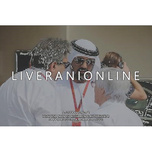 Pasquale Lattuneddu (ITA) of the FOM (Left) and Bernie Ecclestone (GBR) (Right). 25.11.2016. Formula 1 World Championship, Rd 21, Abu Dhabi Grand Prix, Yas Marina Circuit, Abu Dhabi, Practice Day. AG ALDO LIVERANI SAS ONLY ITALY