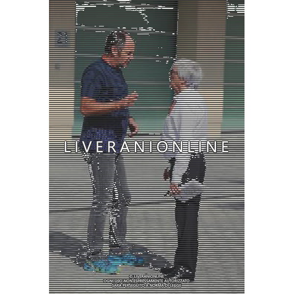 (L to R): Gerhard Berger (AUT) with Bernie Ecclestone (GBR). 25.11.2016. Formula 1 World Championship, Rd 21, Abu Dhabi Grand Prix, Yas Marina Circuit, Abu Dhabi, Practice Day. AG ALDO LIVERANI SAS ONLY ITALY