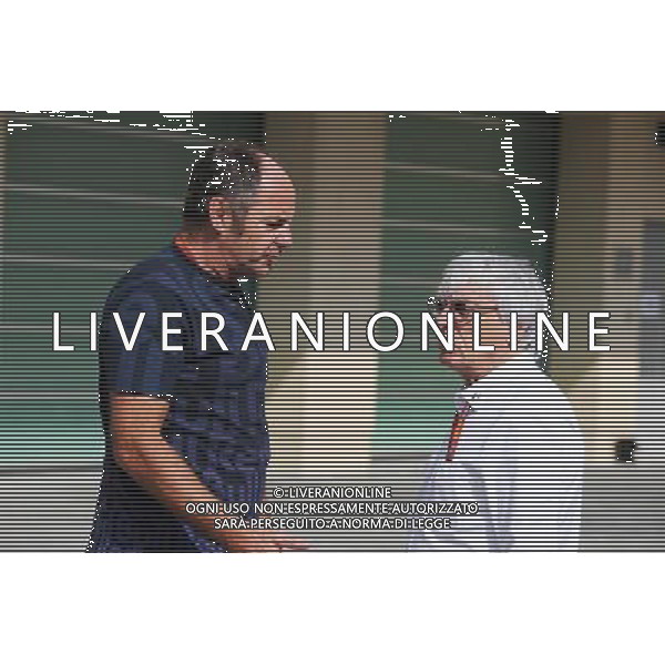 (L to R): Gerhard Berger (AUT) with Bernie Ecclestone (GBR). 25.11.2016. Formula 1 World Championship, Rd 21, Abu Dhabi Grand Prix, Yas Marina Circuit, Abu Dhabi, Practice Day. AG ALDO LIVERANI SAS ONLY ITALY