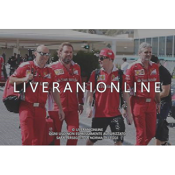 (L to R): Mark Arnall (GBR) Personal Trainer with Gino Rosato (CDN) Ferrari; Kimi Raikkonen (FIN) Ferrari; and Maurizio Arrivabene (ITA) Ferrari Team Principal. 27.11.2016. Formula 1 World Championship, Rd 21, Abu Dhabi Grand Prix, Yas Marina Circuit, Abu Dhabi, Race Day. AG ALDO LIVERANI SAS ONLY ITALY