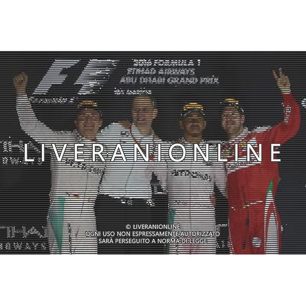 1st place Lewis Hamilton (GBR) Mercedes AMG F1 W07 , 2nd place and new world champion Nico Rosberg (GER) Mercedes AMG Petronas F1 W07 and 3rd place Sebastian Vettel (GER) Scuderia Ferrari SF16-H. 27.11.2016. Formula 1 World Championship, Rd 21, Abu Dhabi Grand Prix, Yas Marina Circuit, Abu Dhabi, Race Day. AG ALDO LIVERANI SAS ONLY ITALY