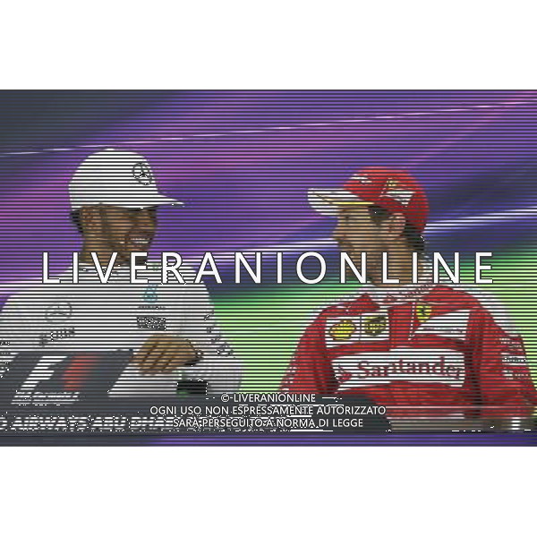 The post race FIA Press Conference (L to R): Lewis Hamilton (GBR) Mercedes AMG F1, race winner; Sebastian Vettel (GER) Ferrari, third. 27.11.2016. Formula 1 World Championship, Rd 21, Abu Dhabi Grand Prix, Yas Marina Circuit, Abu Dhabi, Race Day. AG ALDO LIVERANI SAS ONLY ITALY
